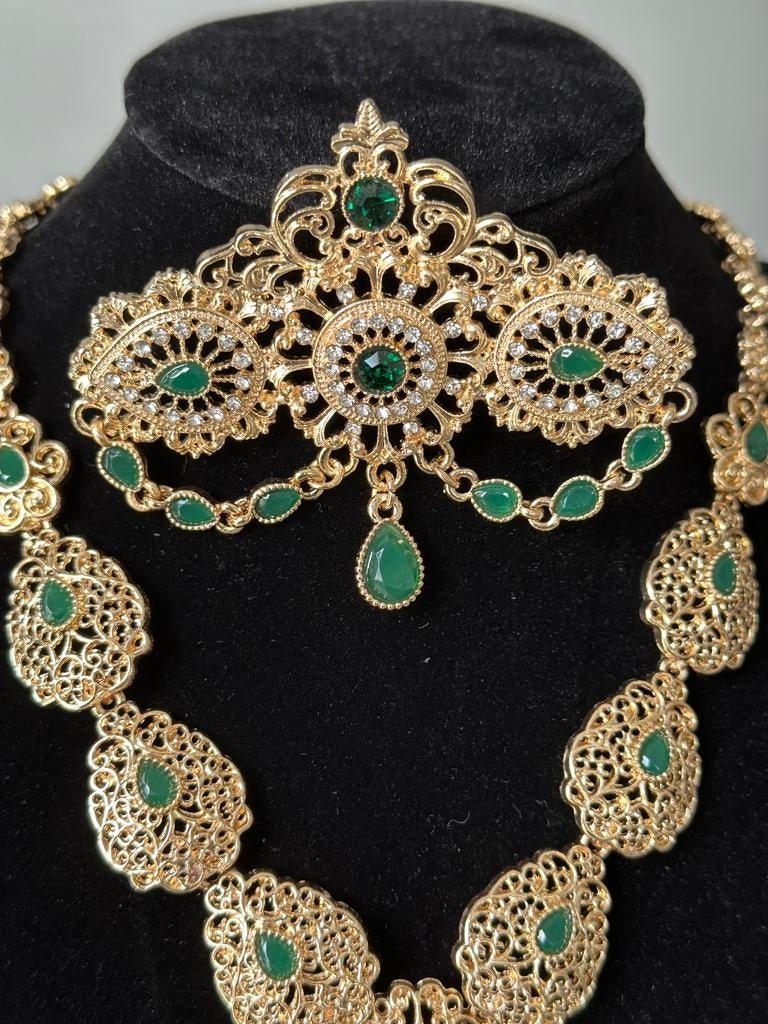 Traditional Brooch in Gold with green stones